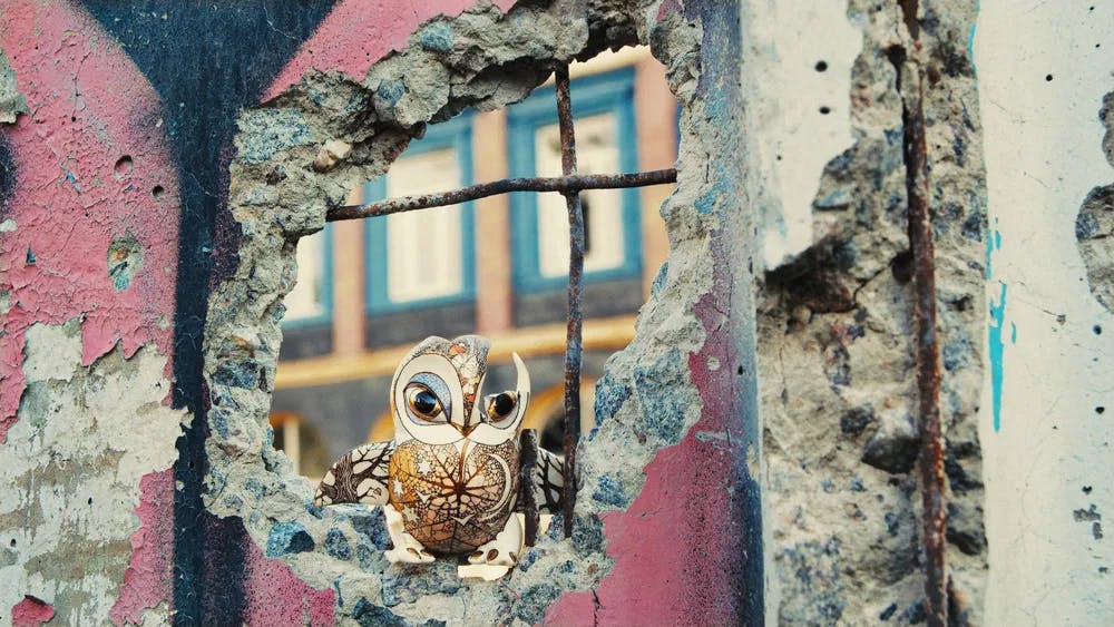 Art among the ruins: an owl made by Slava and Anya Leontyev defies Russian fire in "Porcelain War." / Photo by Slava Leontyev and Andrei Stefanov, courtesy of Sundance Institute.