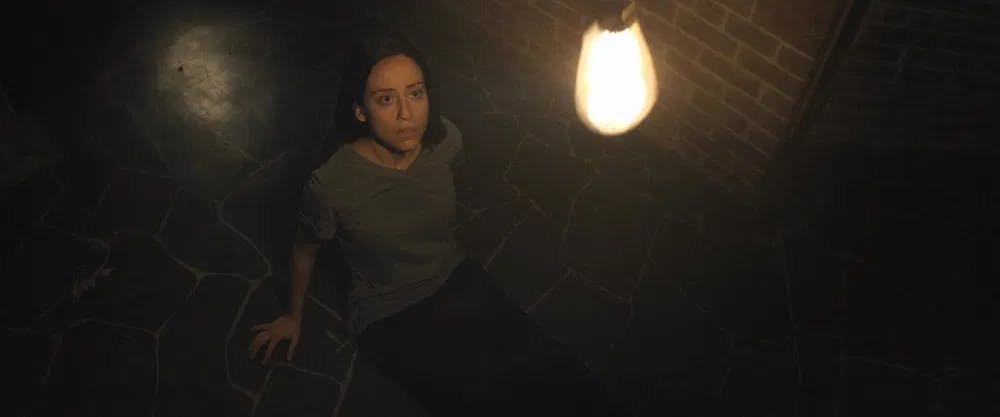 The ghost in you: Kalli Khourshid awakes in a cold, dark basement in "Haunts" / Photo courtesy of Absurd Hero Productions.