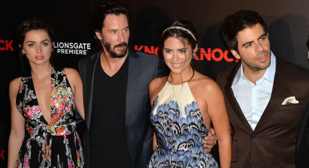 Actors De Armas, Reeves, Izzo, and director Eli Roth at the Hollywood premiere of "Knock Knock" in 2015. / Photo courtesy of Featureflash & Dreamstime.
