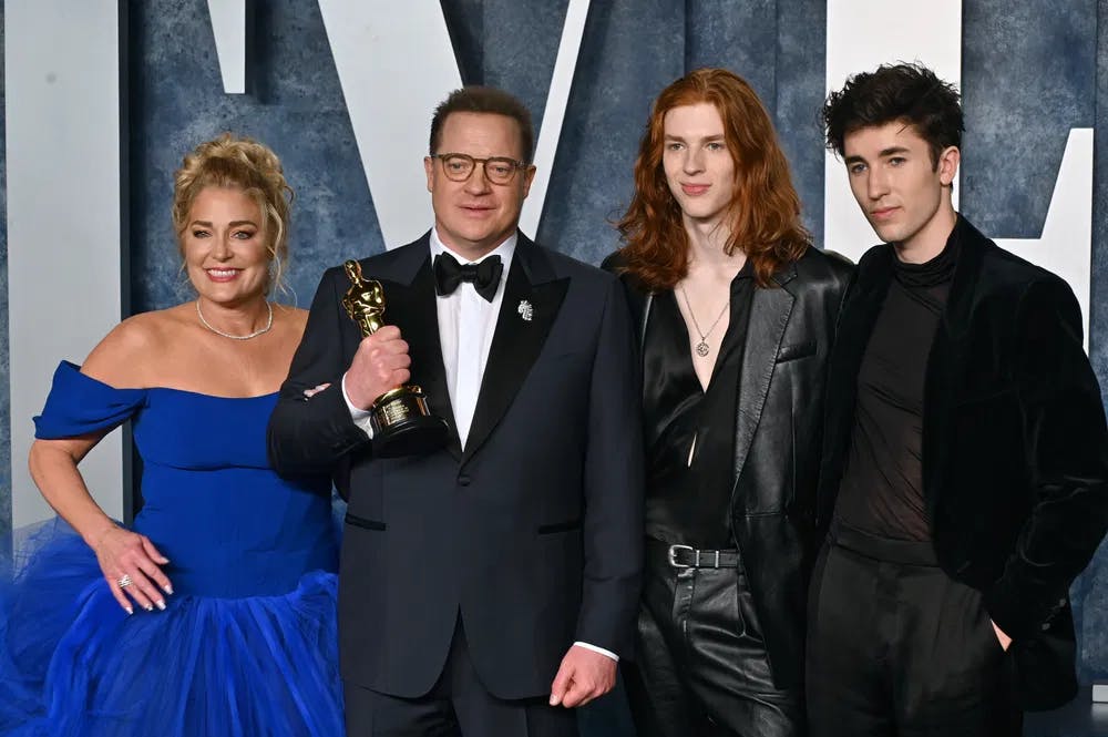 The family welcomes Oscar: Brendan Fraser, his wife Jeanne Moore, and sons celebrate the Academy Award for "The Whale" / Photo courtesy of Dreamstime.