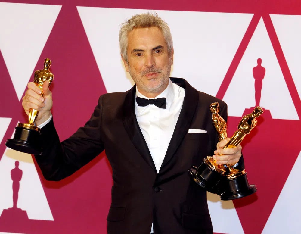 Win by remembrance: Alfonso Cuarón and his three Oscars for "Roma" / Photo courtesy of Dreamstime.