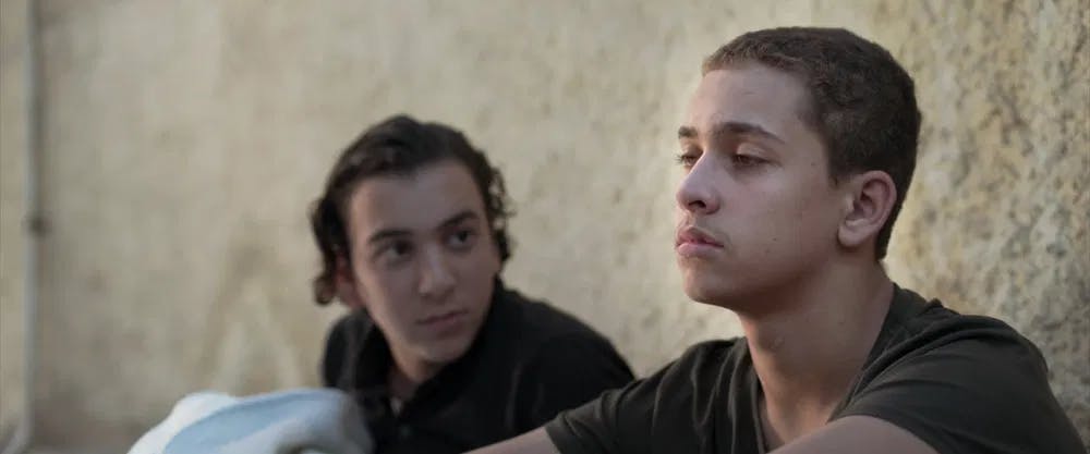 Big brother: Ahmed el Amir gets a little help from pal Ahmed Abd el Razek in "Fifteen" / Photo courtesy of Sameh Alaa & Bekke Films.