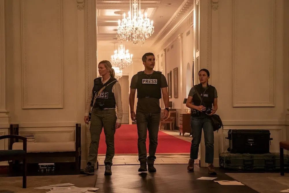White House Blitz: Dunst, Moura, and Spaney scan the decimated halls of power in "Civil War." / Photo courtesy of A24.