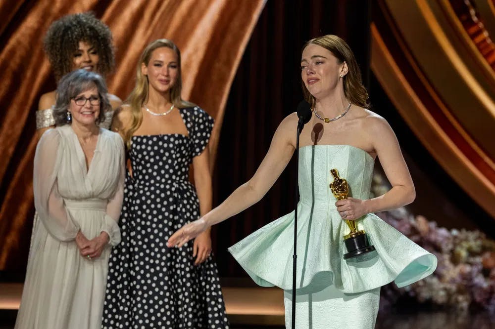 Poor thing: Emma Stone is in as much shock as everybody else, for winning the Best Actress Oscar over favorite Lily Gladstone. / Photo by Trae Patton, courtesy of ©A.M.P.A.S.