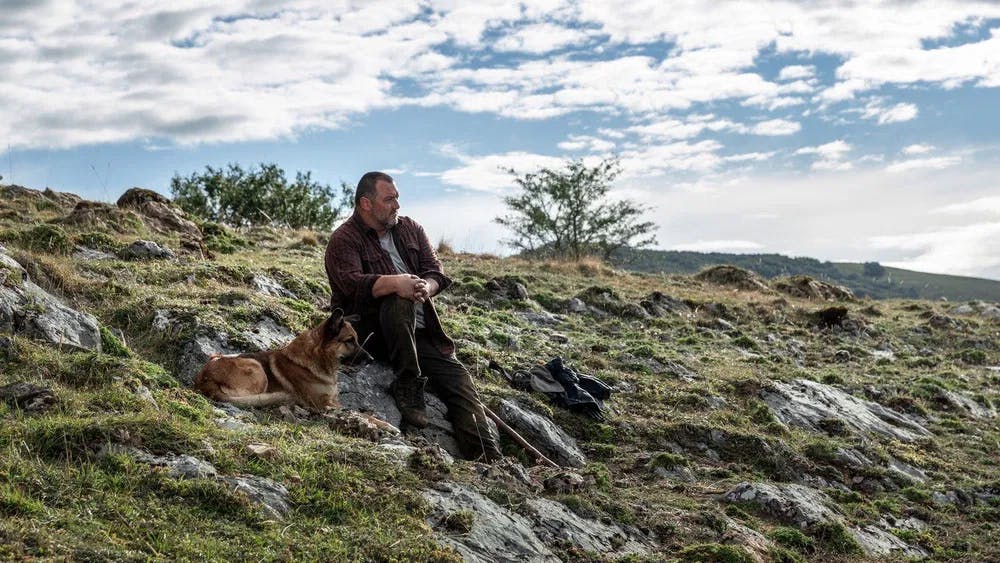 One man's idyllic paradise is another one's awful workplace: Ménochet and dog take in the view in As Bestas / Photo courtesy of Latido Films, Greenwich Entertainment & Curzon