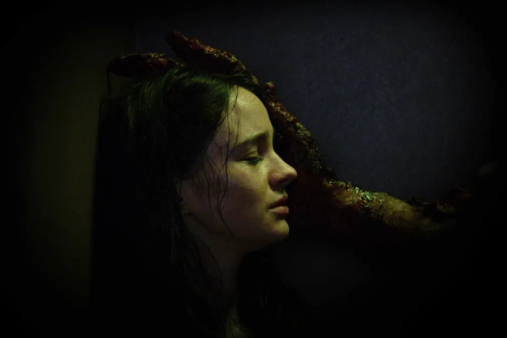 The evil she made: Ella (Aisling Franciosi) gets a visit from the Ash Man in "Stopmotion" / Photo courtesy of Samuel Dole. An IFC Films and Shudder release.