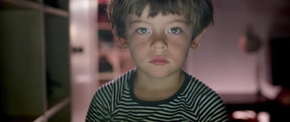 Staring into the future: Natalia Almada's son faces the screen in "Users" / Photo courtesy of Icarus Films.